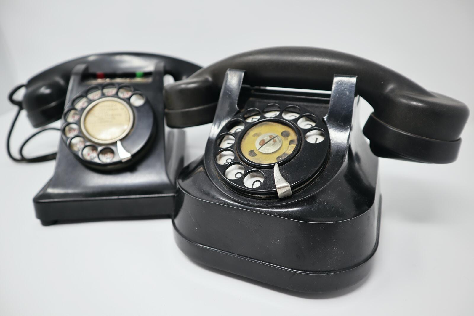 Photo by Call Me Fred two black rotary telephones